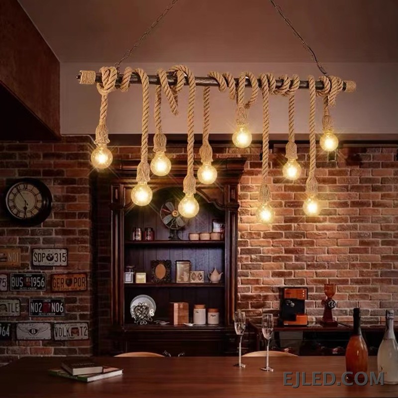 This six-light chandelier features a linear steel bar wrapped with natural hemp rope, suspending exposed bulbs. Two chains connect it to a rectangular ceiling plate, offering a distinctive, open aesthetic. - view 3