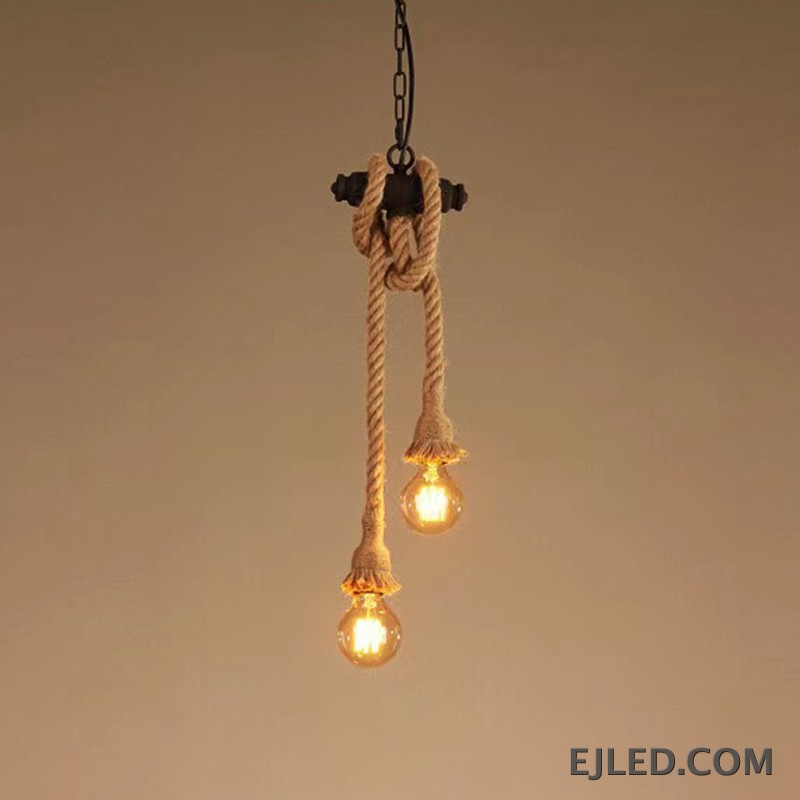 This six-light chandelier features a linear steel bar wrapped with natural hemp rope, suspending exposed bulbs. Two chains connect it to a rectangular ceiling plate, offering a distinctive, open aesthetic. - view 4