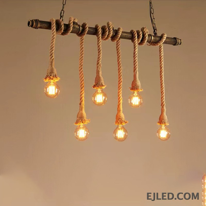 This six-light chandelier features a linear steel bar wrapped with natural hemp rope, suspending exposed bulbs. Two chains connect it to a rectangular ceiling plate, offering a distinctive, open aesthetic. - view 5