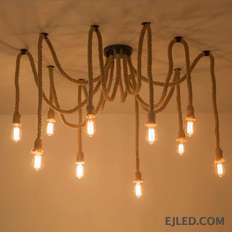 This RP0008 Hemp Rope Chandelier features ten exposed glass bulbs suspended from natural twisted hemp ropes. The ropes extend from a black canopy and mounting points, creating a distinct, organic multi-point lighting design. - view 3