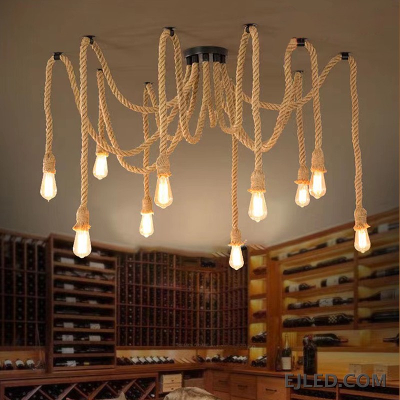 This RP0008 Hemp Rope Chandelier features ten exposed glass bulbs suspended from natural twisted hemp ropes. The ropes extend from a black canopy and mounting points, creating a distinct, organic multi-point lighting design. - view 4