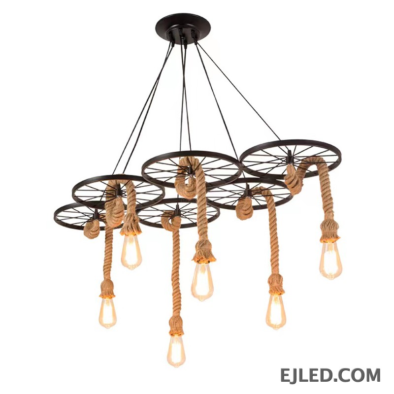 This multi-light hemp rope chandelier features six iron wheel frames, each suspending an exposed bulb. The design combines robust iron with natural rope elements, creating an industrial aesthetic for commercial spaces.