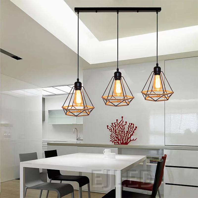 This three-light pendant fixture features diamond-shaped iron cage shades with a hemp rope base. Each lamp hangs from a black cord, all attached to a single rectangular ceiling bar. - view 3