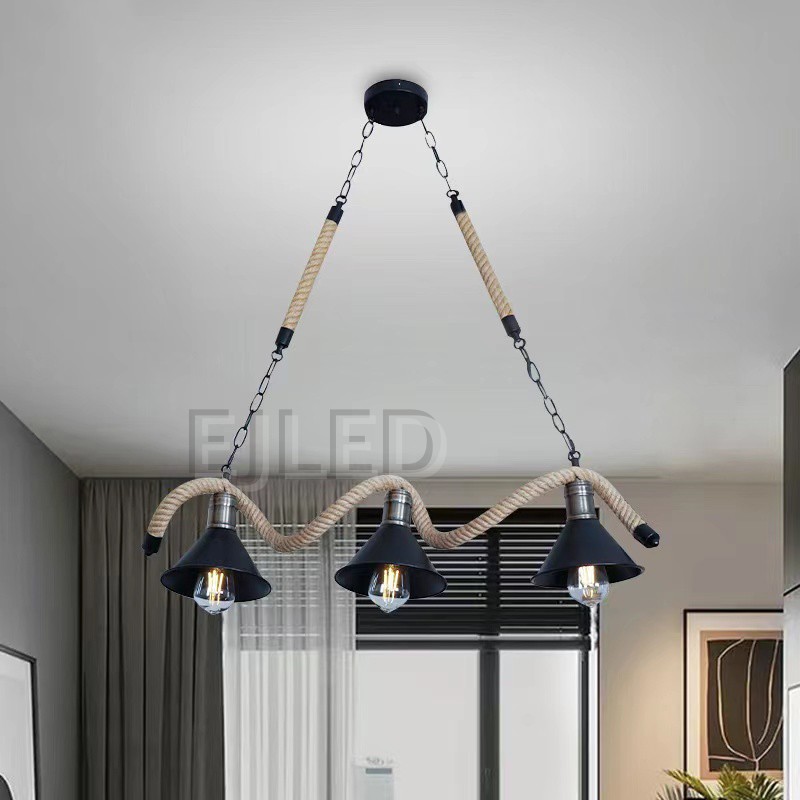 This three-light pendant features bell-shaped metal shades with a black finish, suspended along a wavy hemp rope. It hangs from a black ceiling plate via metal chains and straight ropes, offering a distinctive look. - view 5