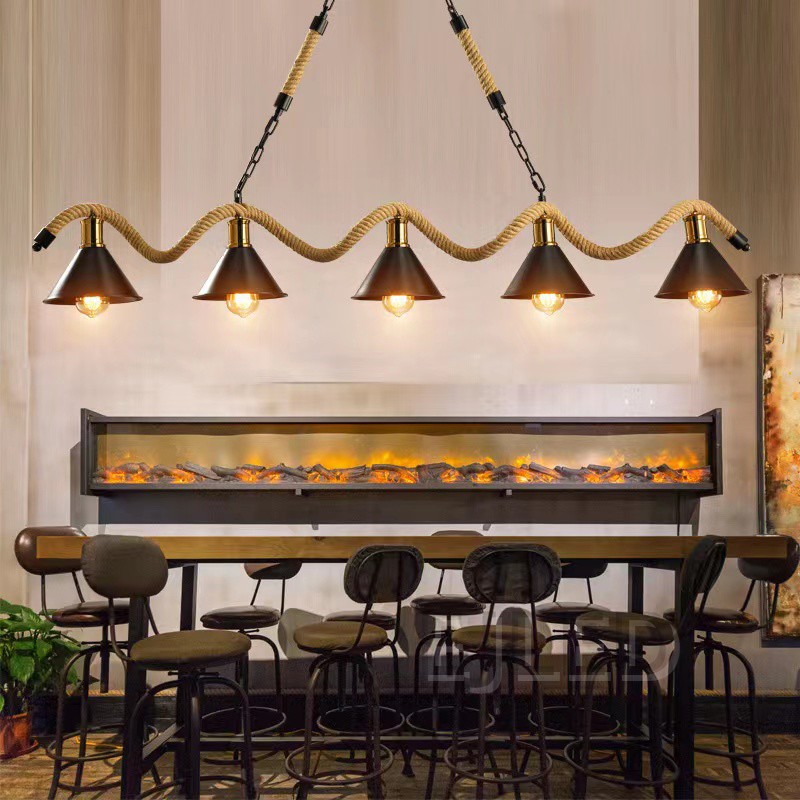 This linear pendant light features five black bell shades suspended along a thick woven hemp rope and metal chain assembly from a rectangular ceiling canopy. - view 4