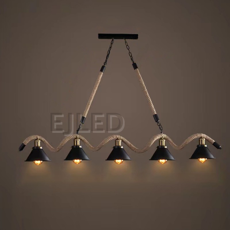This linear pendant light features five black bell shades suspended along a thick woven hemp rope and metal chain assembly from a rectangular ceiling canopy. - view 5