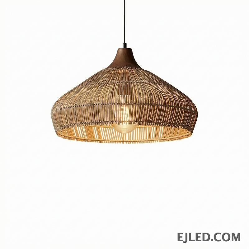 This RT0472 pendant lamp features a handwoven natural rattan shade in a flared dome shape. Its open construction allows ambient light to filter through the wicker, illuminating the single visible lamp.