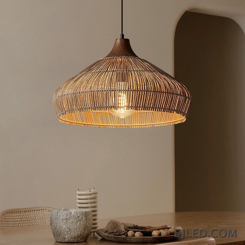 This RT0472 pendant lamp features a handwoven natural rattan shade in a flared dome shape. Its open construction allows ambient light to filter through the wicker, illuminating the single visible lamp. - view 2