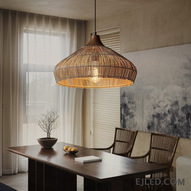 This RT0472 pendant lamp features a handwoven natural rattan shade in a flared dome shape. Its open construction allows ambient light to filter through the wicker, illuminating the single visible lamp. - view 3