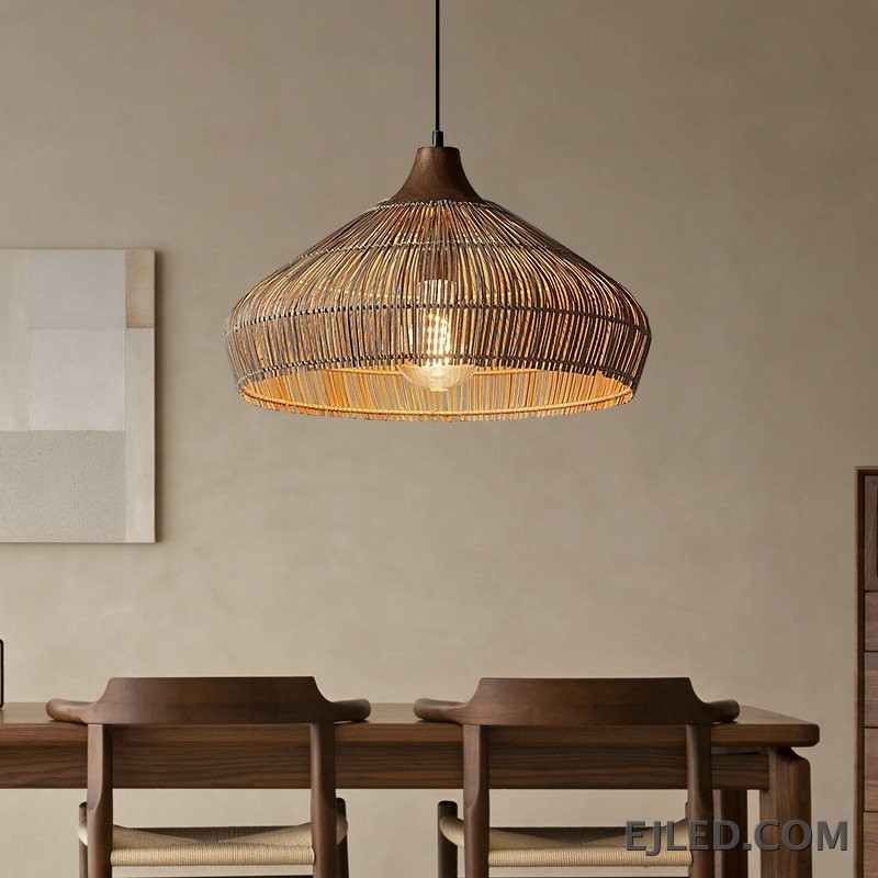 This RT0472 pendant lamp features a handwoven natural rattan shade in a flared dome shape. Its open construction allows ambient light to filter through the wicker, illuminating the single visible lamp. - view 4