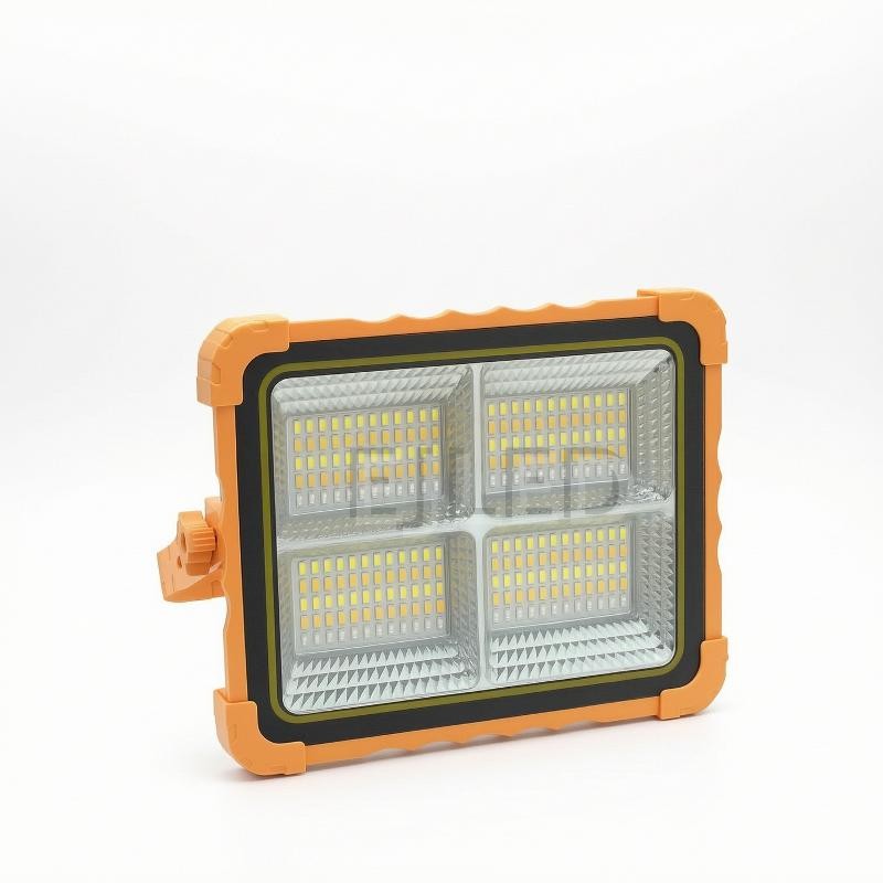 This industrial grade aluminum outdoor LED flood light features an orange and black finish with four high brightness lamp panels for security areas.