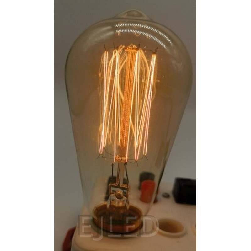 This amber glass incandescent bulb features a teat shape with a visible interior tungsten filament, creating a warm, vintage look for decorative lighting. - view 6
