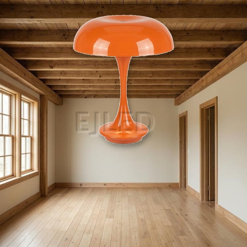This bright orange metal table lamp features a wide dome shade and a slender trumpet base with a smooth glossy finish. - view 4