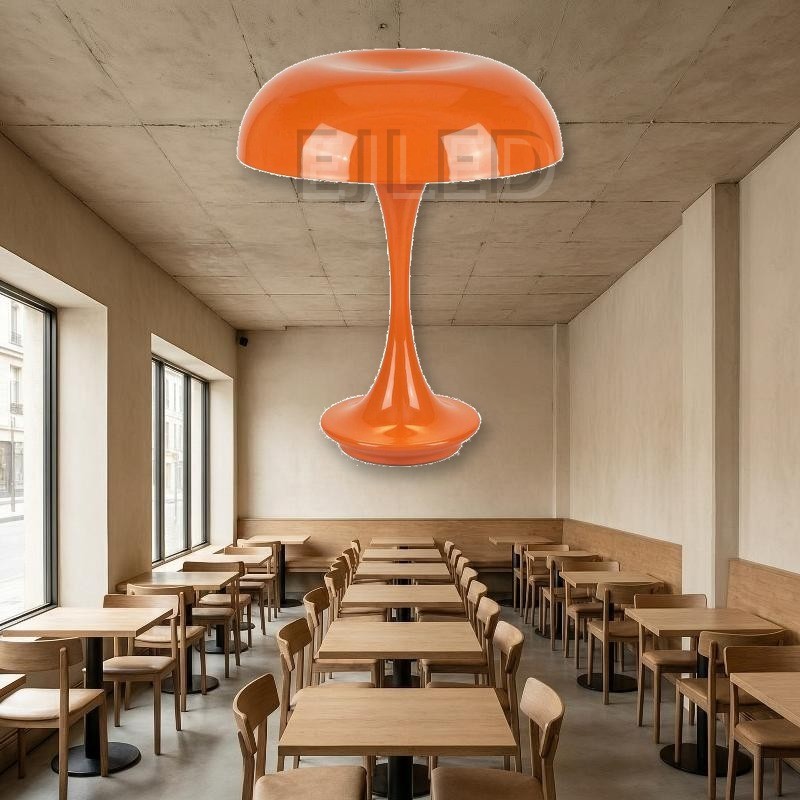This bright orange metal table lamp features a wide dome shade and a slender trumpet base with a smooth glossy finish. - view 5