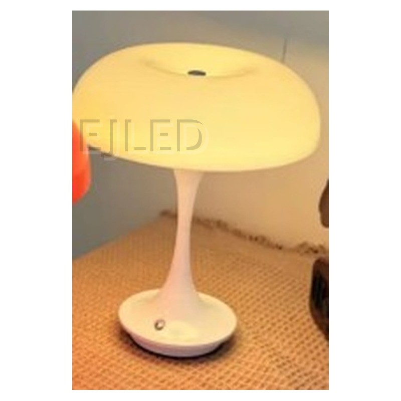 This white resin table lamp features a rounded shade and a slender pedestal base. It provides warm illumination for wholesale and hotel projects. - view 2