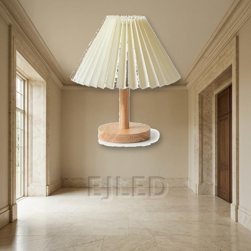 This wooden base table lamp features an off white pleated fabric shade supported by a natural wood stem and round wooden base. - view 5
