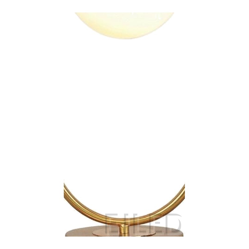 This modern gold table lamp features an open metal loop frame supporting a white spherical glass shade over a round brass base. - view 3