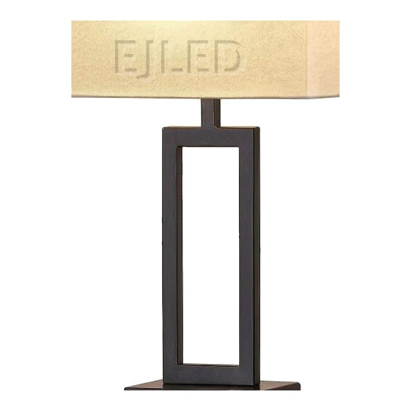 This modern table lamp features a dark metal rectangular base, an open geometric column, and a trapezoid fabric shade with built-in USB charging ports. - view 3