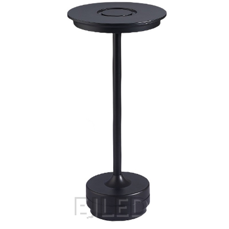 This black metal table lamp features a slim vertical stem connecting a flat circular top shade to a weighted round base. It provides portable cordless illumination. - view 2