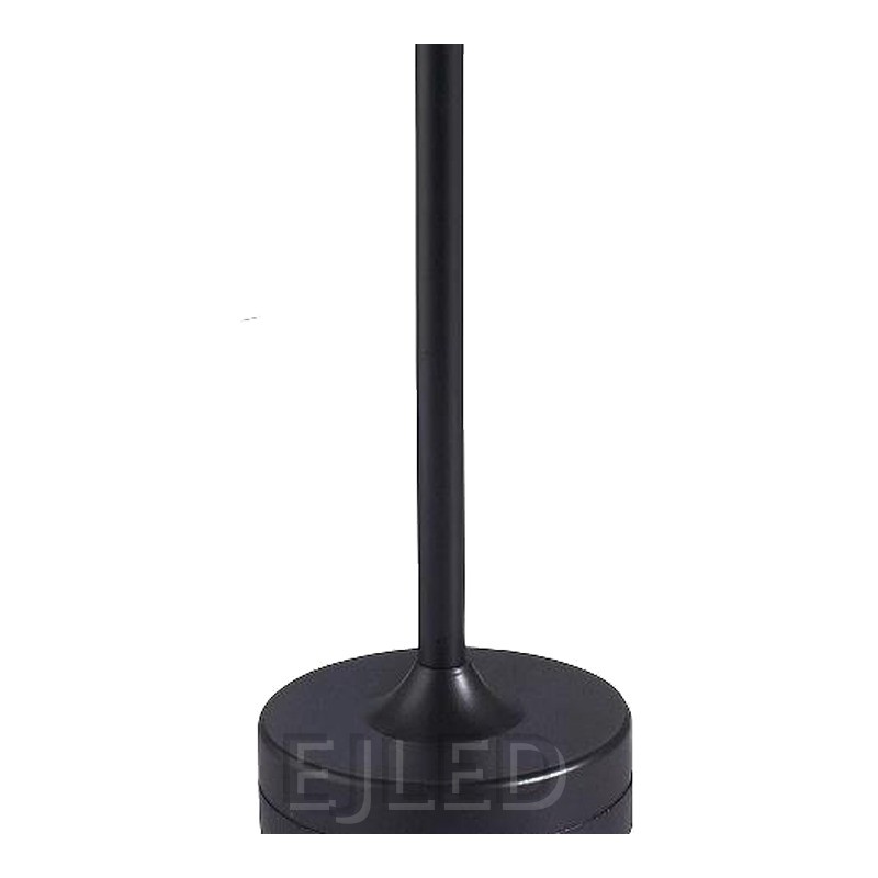 This black metal table lamp features a slim vertical stem connecting a flat circular top shade to a weighted round base. It provides portable cordless illumination. - view 3
