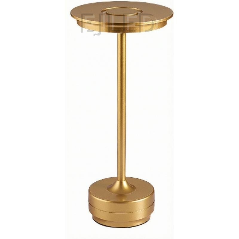 This minimalist metal table lamp features a solid round base, a slender vertical stem, and a flat circular top shade in a uniform gold finish.