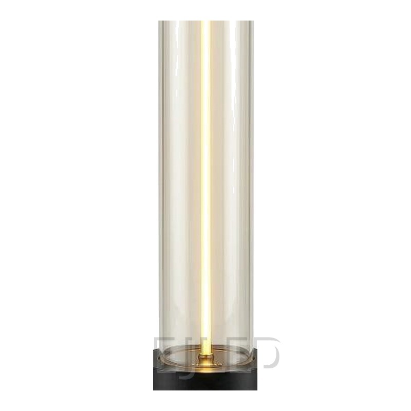 This cylindrical glass table lamp features a glowing central light tube mounted on a heavy black metal base with matching top trim. - view 3