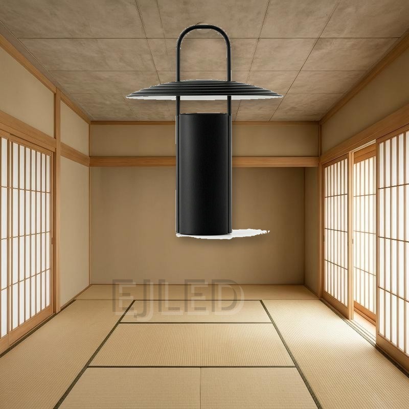 This black metal table lamp features a cylindrical base, a ribbed conical shade, and an upright handle running through the center. - view 4