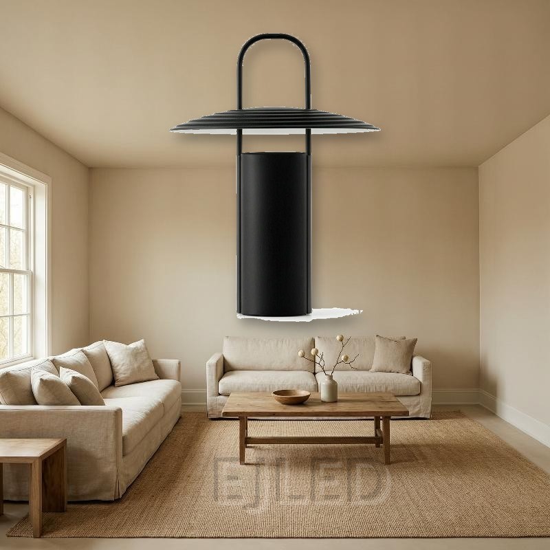 This black metal table lamp features a cylindrical base, a ribbed conical shade, and an upright handle running through the center. - view 5