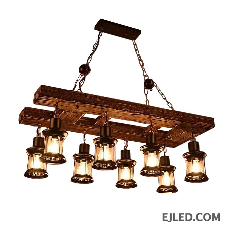 This cylindrical wooden pendant lamp, the WD0003, features an open base designed to direct light downwards. Its darker wood finish provides a contrasting accent, making it suitable for focused illumination.