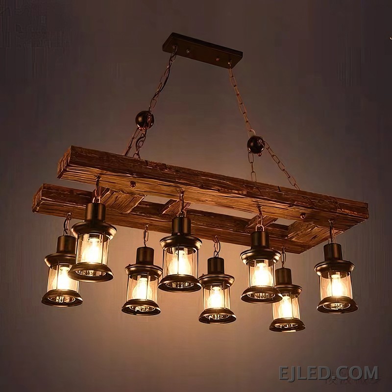 This cylindrical wooden pendant lamp, the WD0003, features an open base designed to direct light downwards. Its darker wood finish provides a contrasting accent, making it suitable for focused illumination. - view 2