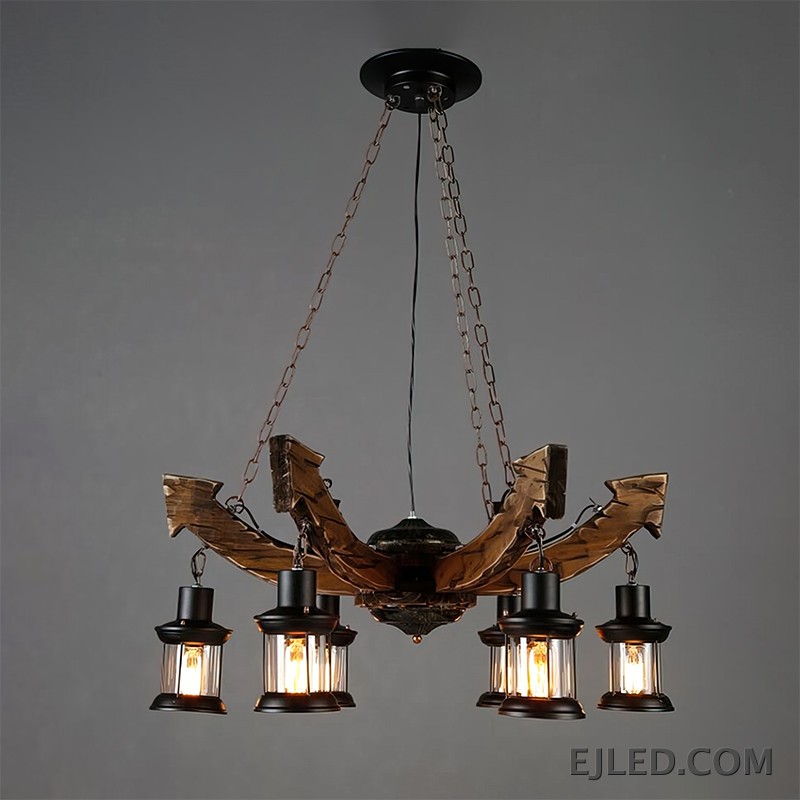 This wooden chandelier features six lantern-style lights suspended from curved, dark brown wooden beams. Each lamp includes a black metal frame and clear, ribbed glass, providing warm, enclosed illumination from visible filament bulbs. - view 2