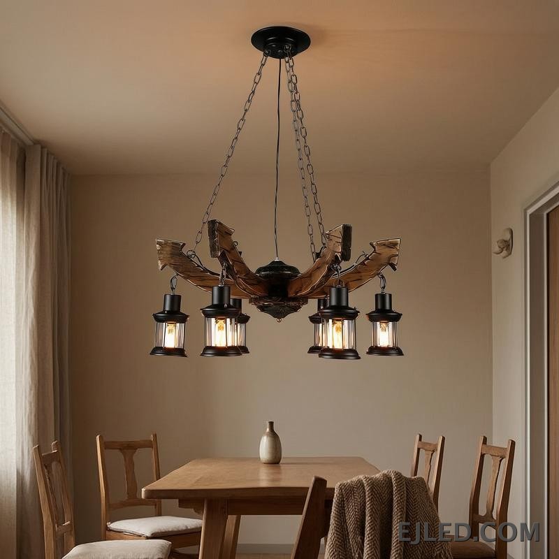 This wooden chandelier features six lantern-style lights suspended from curved, dark brown wooden beams. Each lamp includes a black metal frame and clear, ribbed glass, providing warm, enclosed illumination from visible filament bulbs. - view 6