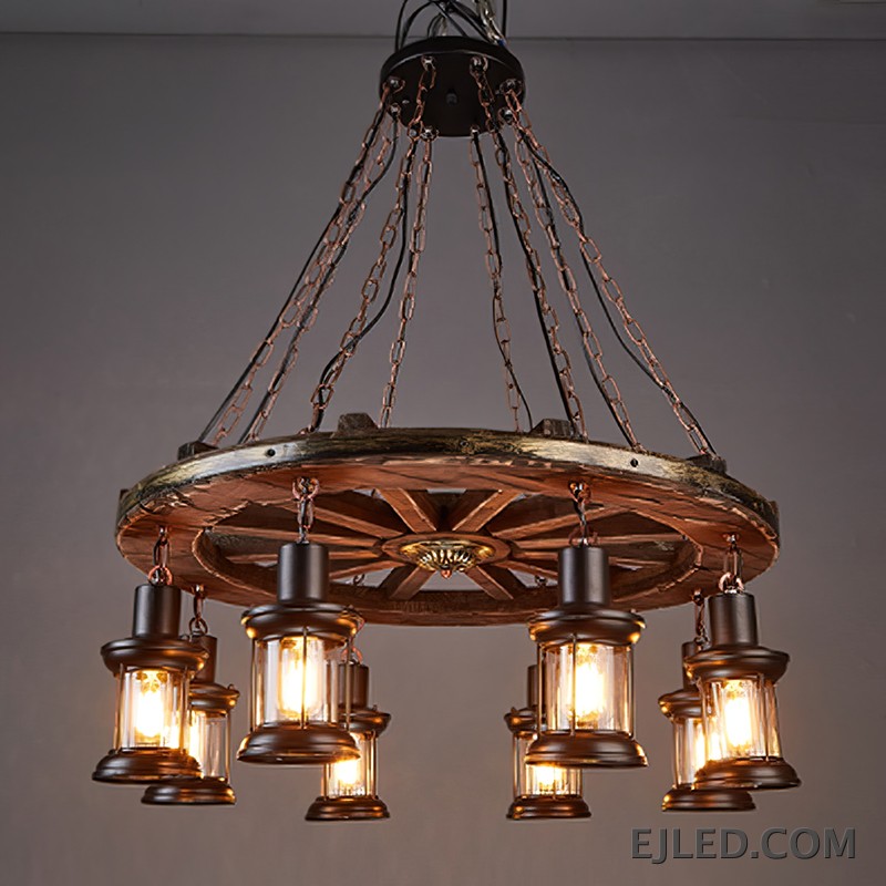 This fixture features a distressed wooden wagon wheel frame suspending eight lantern-style lights. It hangs from multiple chains, creating a rustic aesthetic suitable for various interior designs. - view 3