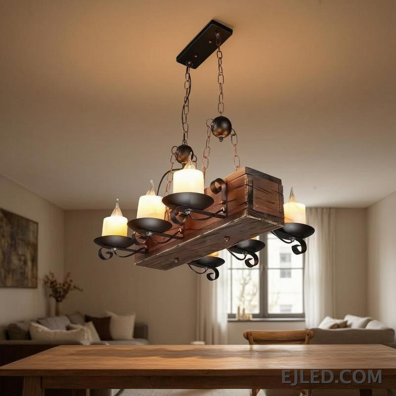This pendant chandelier features a rectangular wooden beam body suspended by chains. Multiple candle-style lights are mounted on dark metal holders, offering a distinct rustic aesthetic suitable for various project designs. - view 3