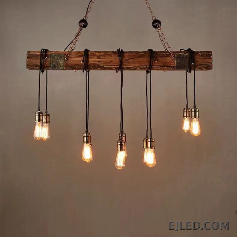 This WD0012 pendant lamp features a rectangular wooden beam suspending five exposed Edison-style bulbs from twisted cords. It hangs from a dark metal ceiling plate by two chains, offering open illumination. - view 3