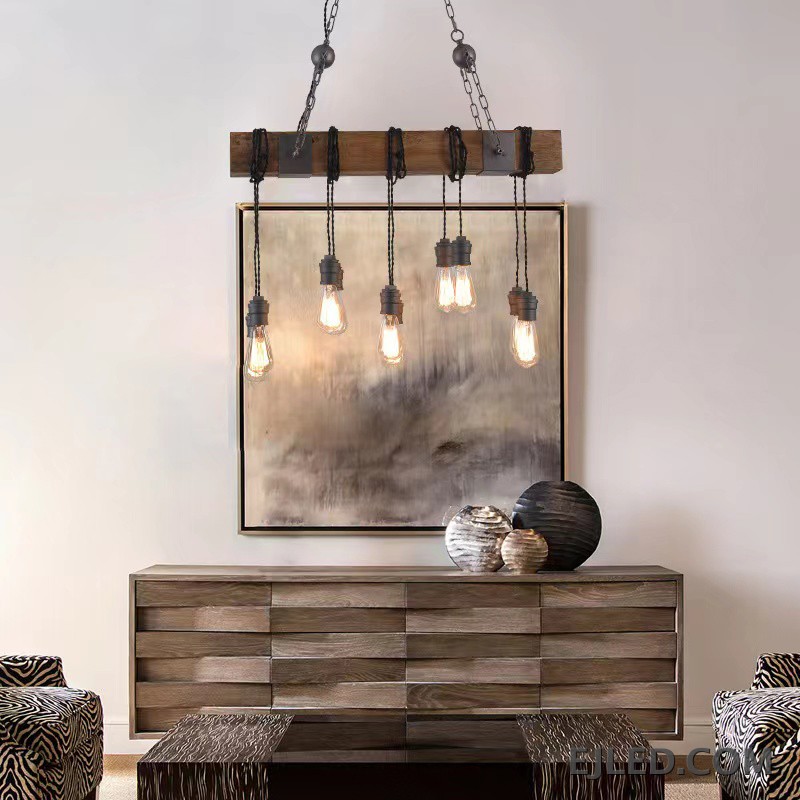 This WD0012 pendant lamp features a rectangular wooden beam suspending five exposed Edison-style bulbs from twisted cords. It hangs from a dark metal ceiling plate by two chains, offering open illumination. - view 5