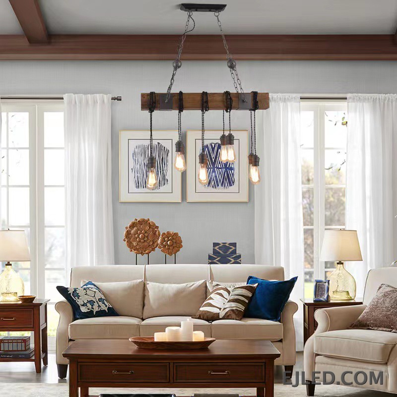 This WD0012 pendant lamp features a rectangular wooden beam suspending five exposed Edison-style bulbs from twisted cords. It hangs from a dark metal ceiling plate by two chains, offering open illumination. - view 6