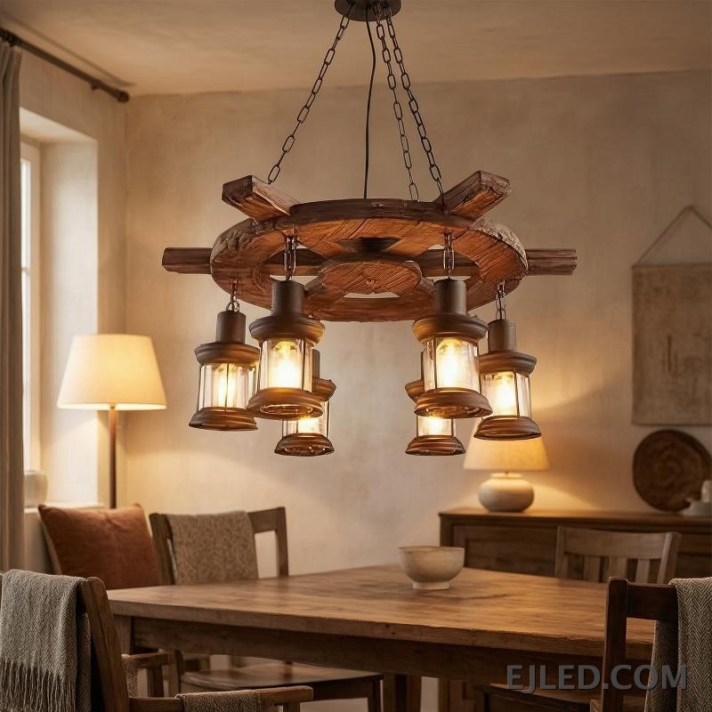 This wooden chandelier features a dark, rustic wagon wheel design with a 75cm diameter. Six clear glass lantern-style lights hang, offering an enclosed yet visible light source. - view 4