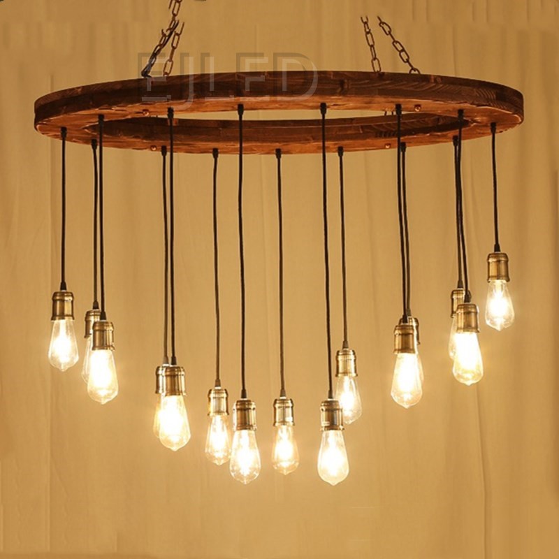 This rustic wood wheel chandelier features a circular wooden frame suspended by a chain, holding multiple hanging pendant lights with brass sockets and Edison bulbs. - view 2
