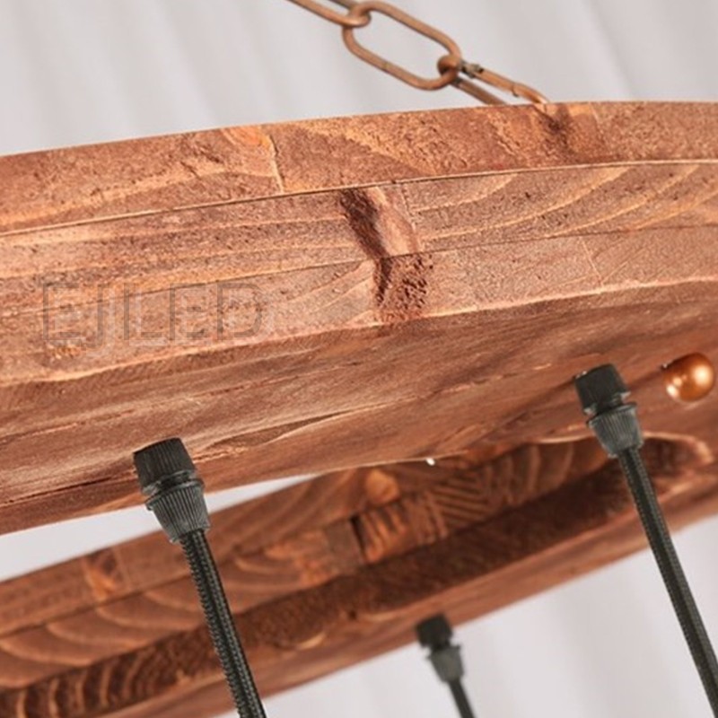This rustic wood wheel chandelier features a circular wooden frame suspended by a chain, holding multiple hanging pendant lights with brass sockets and Edison bulbs. - view 3