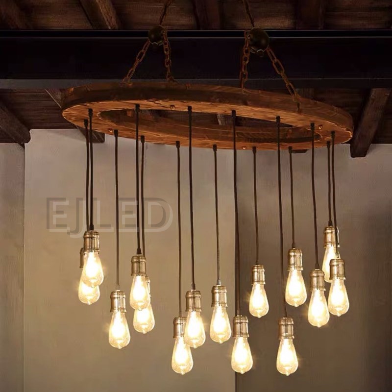 This rustic wood wheel chandelier features a circular wooden frame suspended by a chain, holding multiple hanging pendant lights with brass sockets and Edison bulbs. - view 6