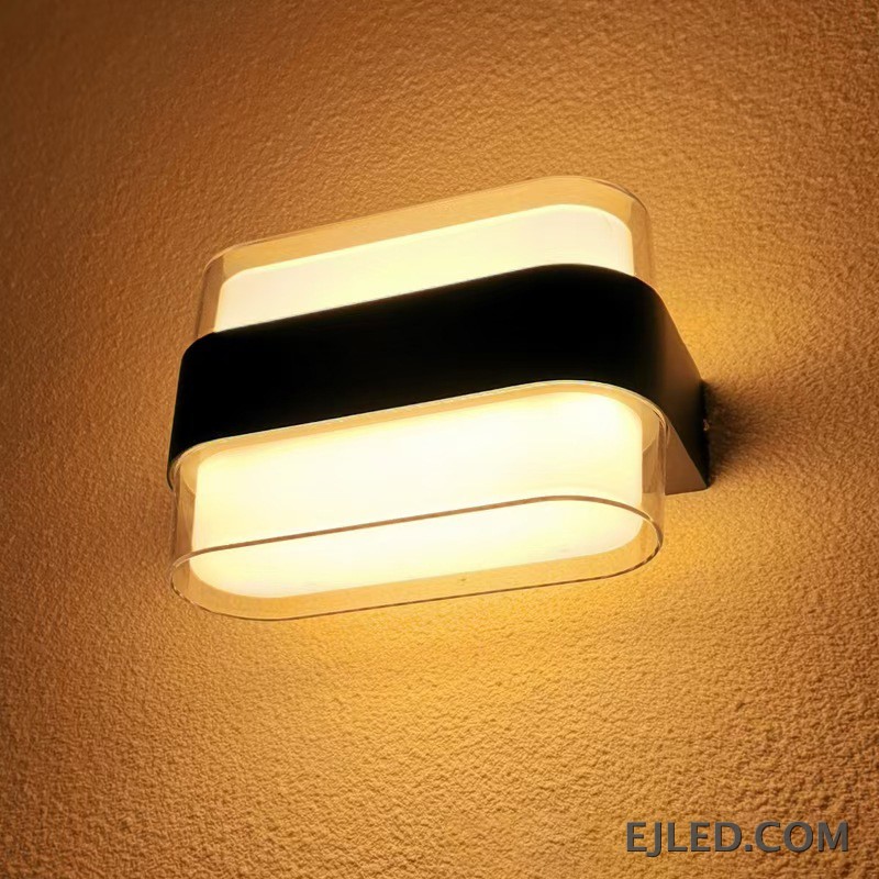 This wall lamp features a black aluminum body and two rectangular glass diffusers. It is designed for surface mounting and provides diffused light both upwards and downwards. - view 2