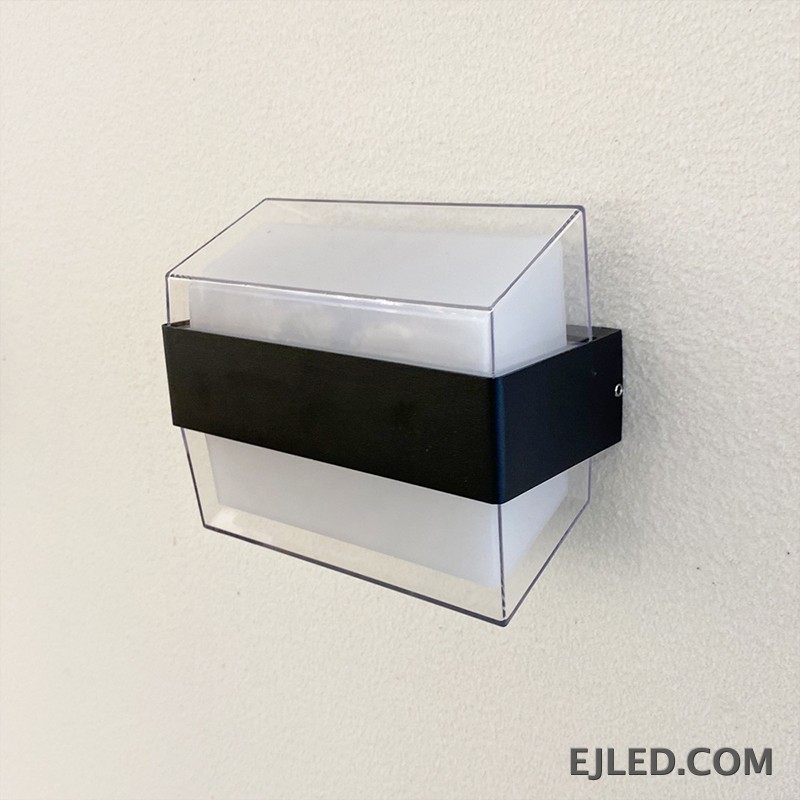 The WL0009 is an acrylic wall light featuring a clear outer casing, a white diffuser, and a distinctive black mid-band. Its angled profile provides diffused illumination. - view 3