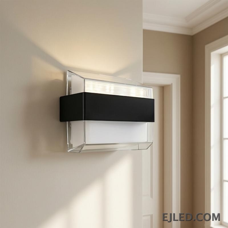 The WL0009 is an acrylic wall light featuring a clear outer casing, a white diffuser, and a distinctive black mid-band. Its angled profile provides diffused illumination. - view 5