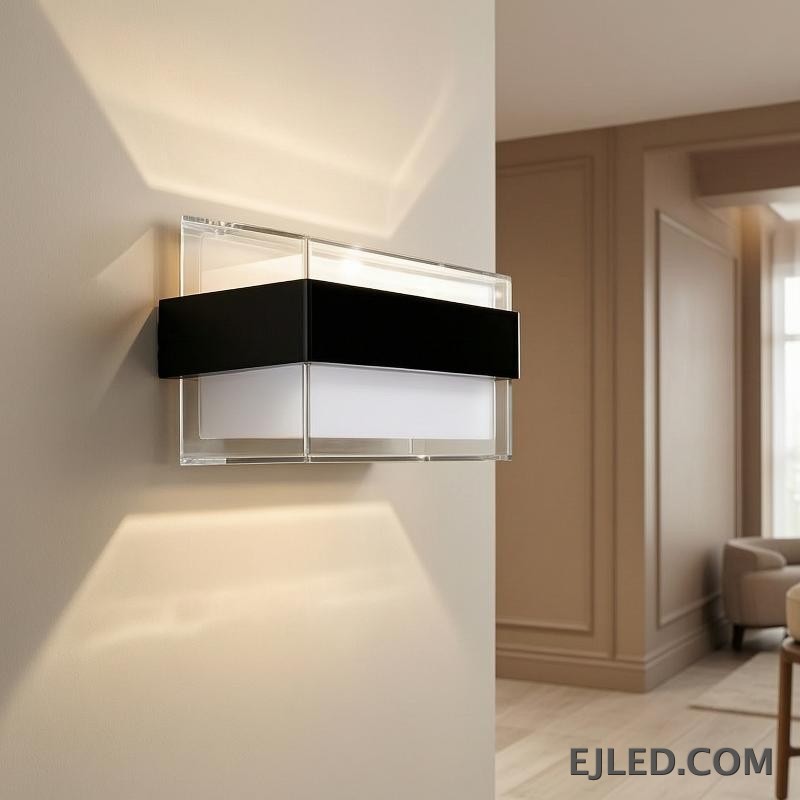 The WL0009 is an acrylic wall light featuring a clear outer casing, a white diffuser, and a distinctive black mid-band. Its angled profile provides diffused illumination. - view 6