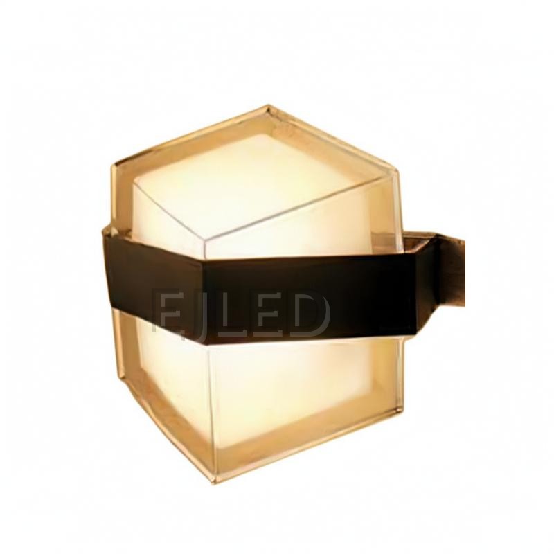 This hexagonal acrylic wall light features a clear outer shade, a white internal diffuser, and a distinct dark band around its middle. It provides enclosed illumination from a wall-mounted fixture.