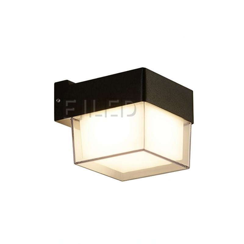 This compact square wall light features a durable black plastic body with a clear outer protective frame enclosing an inner white diffuser.