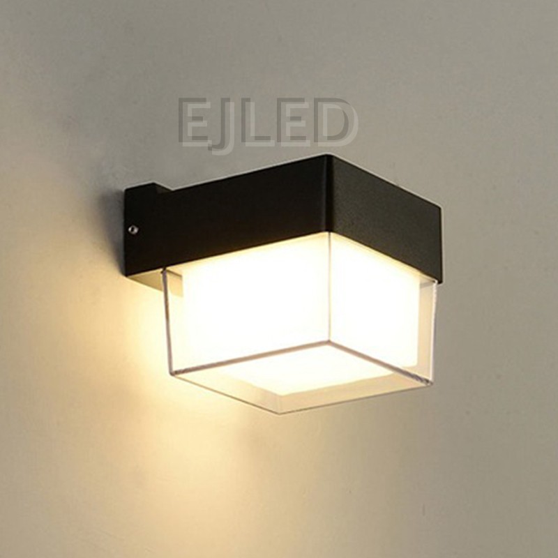 This compact square wall light features a durable black plastic body with a clear outer protective frame enclosing an inner white diffuser. - view 2
