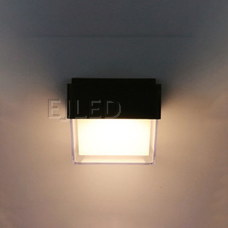 This compact square wall light features a durable black plastic body with a clear outer protective frame enclosing an inner white diffuser. - view 3