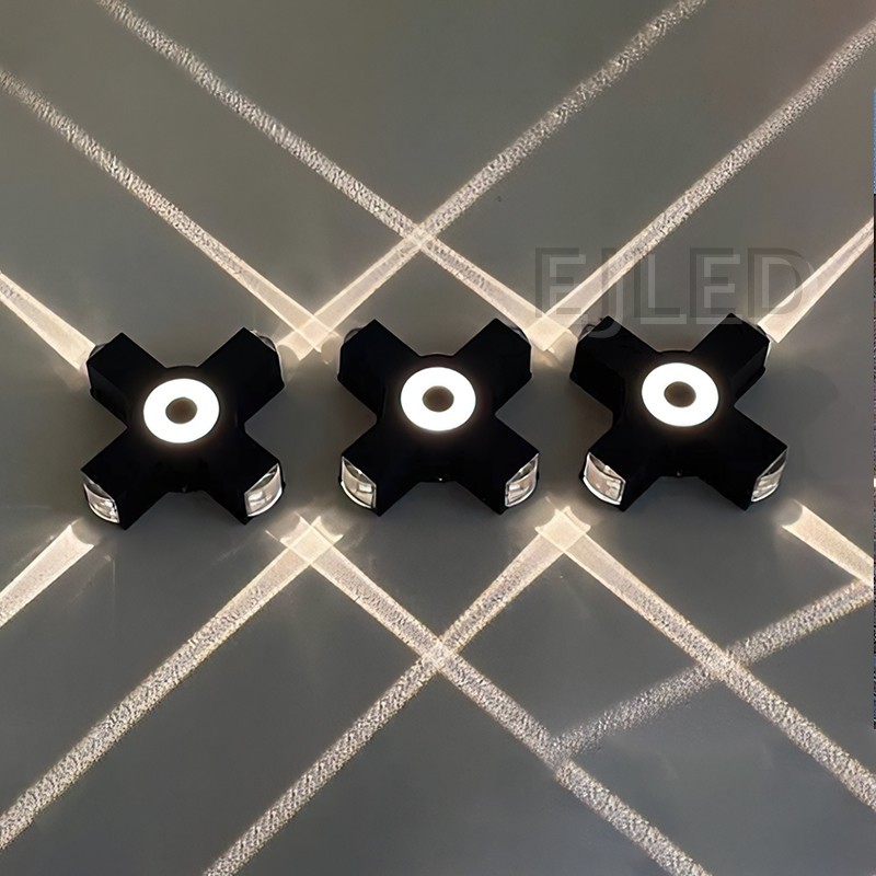 Este aplique de pared de aluminio negro presenta un cuerpo rectangular con un elemento circular luminoso central y extremos de montaje expuestos, creando una silueta moderna distintiva. - view 3